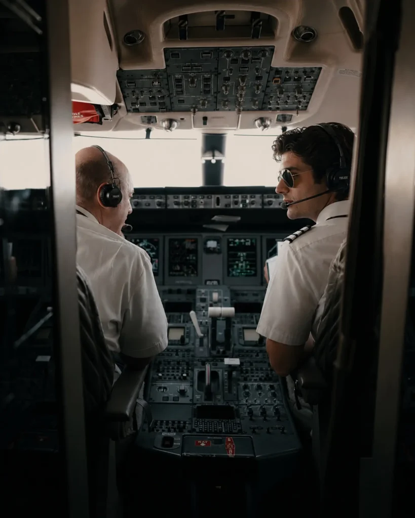 Pilots preparing in a private jet cockpit before departure